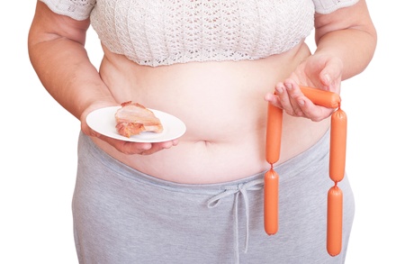 Fat woman holding meat and sausages  isolated on white backgroundの写真素材