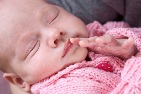 Sleeping newborn baby girl の写真素材