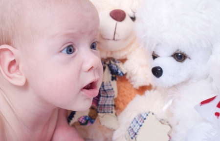 Newborn baby playing with toysの写真素材