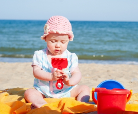 Baby girl on the beachの写真素材