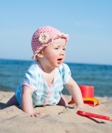 Baby girl on the beachの写真素材