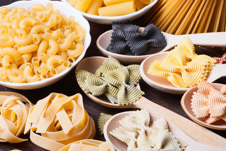 Colorful pasta on wooden backgroundの写真素材