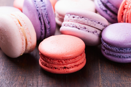 Sweet and colourful french macaroons on wooden backgroundの写真素材