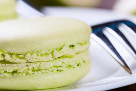 Sweet lime french macaroons on wooden backgroundの写真素材