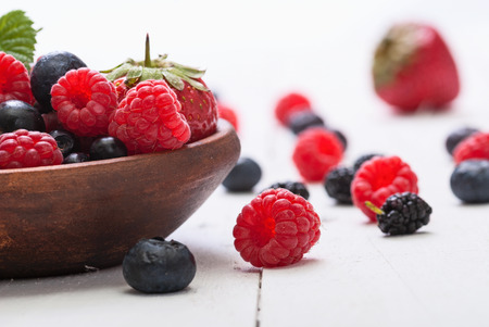 different fresh berries as background