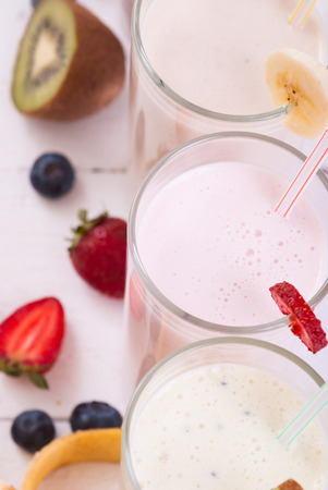 Fruit smoothies with blueberries , strawberry, kiwi and bananaの写真素材