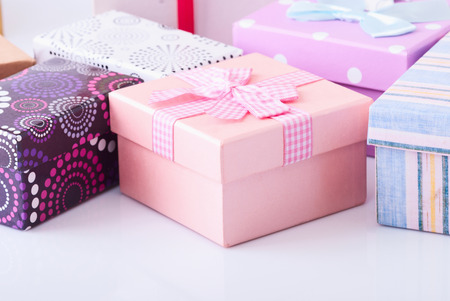 colorful gift boxes on white table.