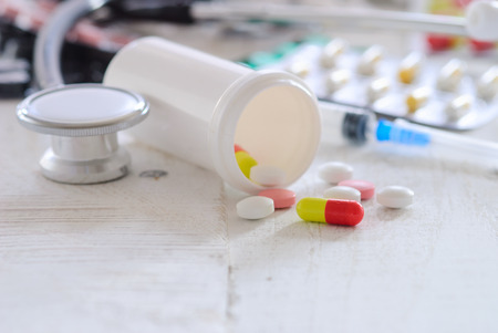 Different medical bottles and tabletsの写真素材
