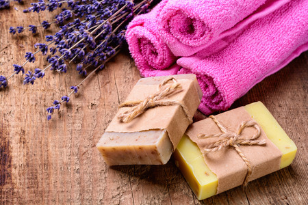Lavender soap and salt on rustic wooden board. Spa conceptの写真素材