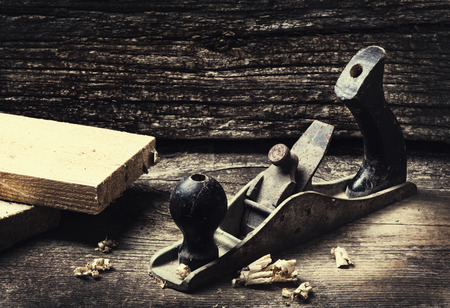 Old vintage hand tools on wooden background