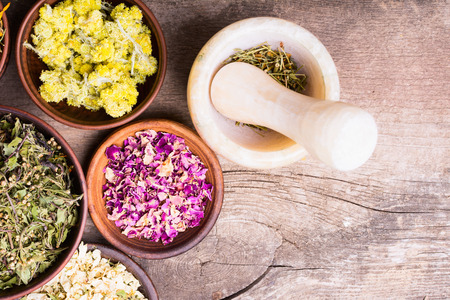 Nature medicine . Herbs on wooden background .の写真素材