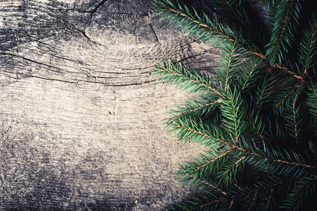 Christmas tree on wooden background with space for textの写真素材