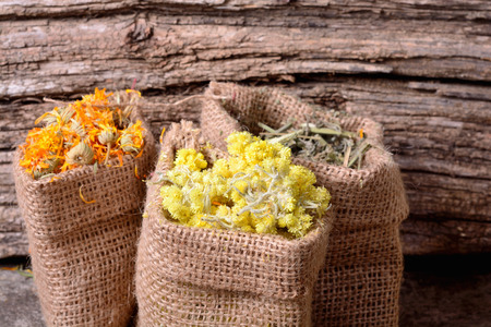 Nature medicine . Herbs on wooden background .の写真素材