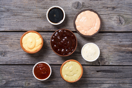 Set of sauces in white saucers . Top viewの写真素材