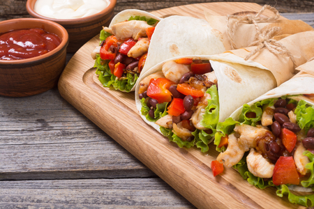 Mexican burrito with chicken , pepper and beansの写真素材