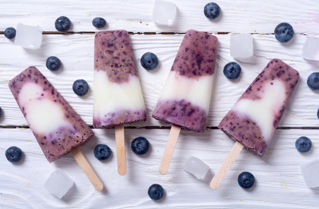 Ice yogurt ice pop with blueberries. Top viewの写真素材