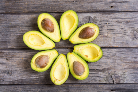 Fresh avocado on wooden background , top view