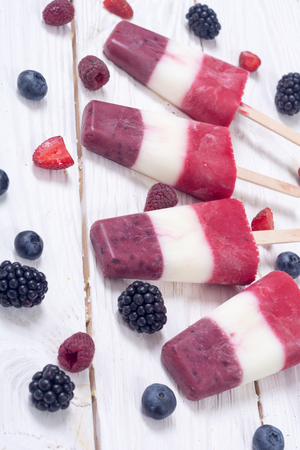 Colorful homemade popsicle with yogurt and berries .の写真素材