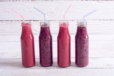 Fresh homemade smoothies with berries on rustic background . の写真素材