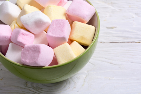 Colorful marshmallow in bowl background . White , pink and yellowの写真素材