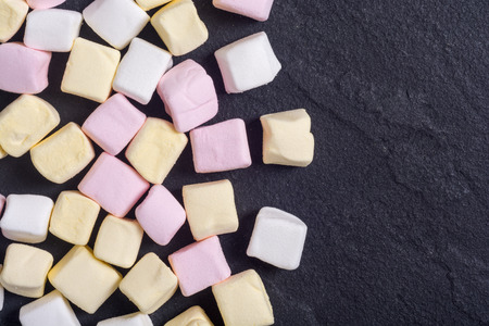 Colorful marshmallow skewers . Yellow , pink and whiteの写真素材