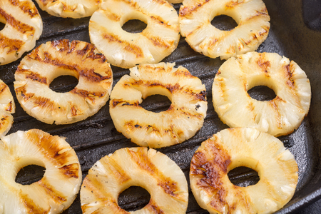 Grilled healthy pineapple on grilled panの写真素材