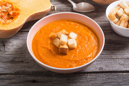 Pumpkin cream soup with croutonsの写真素材