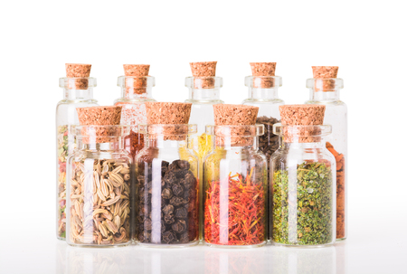 Indian spices in bottles isolated on backgroundの写真素材