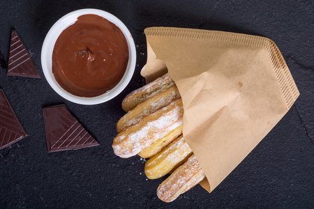 Spanish and mexican dessert : homemade churros  with chocolateの写真素材