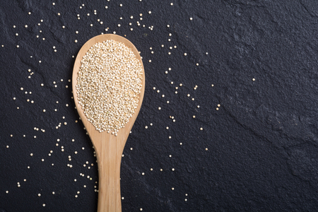 Black , white and red quinoa in spoon on wooden background . Superfood の写真素材