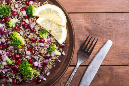 Quinoa salad with pomegranate , broccoli and onionの写真素材