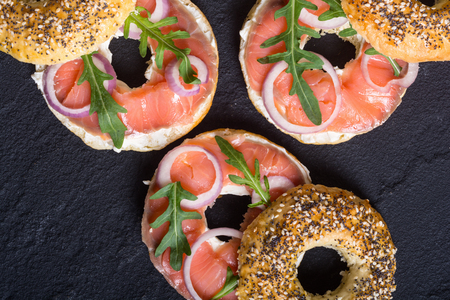 Homemade bagels with salmon , cream cheese and onion .の写真素材