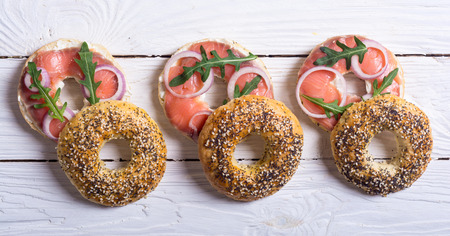 Homemade bagels with salmon , cream cheese and onion .の写真素材