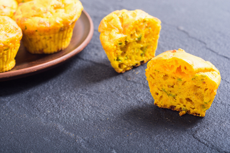 Homemade baked muffins with cheese and eggs . Food background