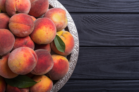 Ripe peaches fruit on rustic background . Summer healthy foodの写真素材