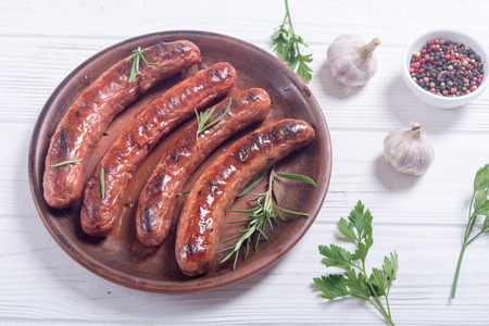 Grilled sauusages on a plate . Unhealthy food background . Barbecueの写真素材