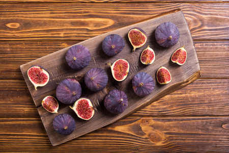 Fresh autumn fruit figs . Healthy food on rustic backgroundの写真素材