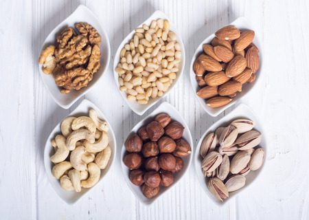 Mix of nuts : Pistachios, almonds , walnuts , pine nut , hazelnuts and cashew . Snack in bowl backgrondの写真素材