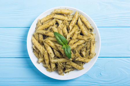 Italian penne pasta with sauce pesto . Food backgroundの写真素材