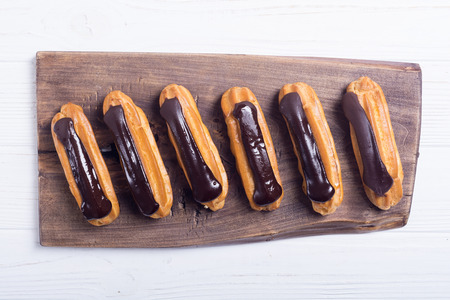 French dessert eclair with chocolate . Delicious food backgroundの写真素材