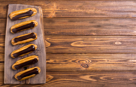French dessert eclair with chocolate . Delicious food background