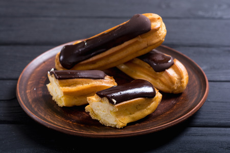 French dessert eclair with chocolate . Delicious food backgroundの写真素材