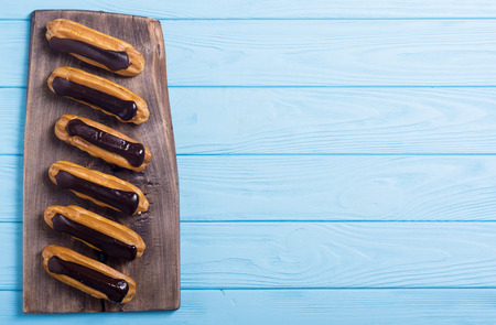 French dessert eclair with chocolate . Delicious food background