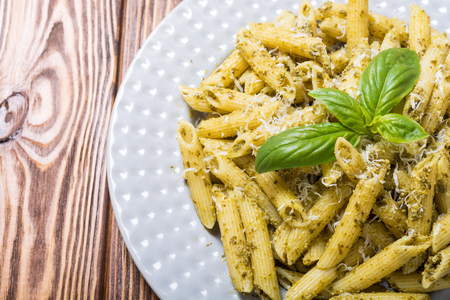 Italian penne pasta with sauce pestoの写真素材