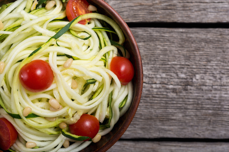 Zucchini pasta noodles with tomatoes . Healthy vegetarian foodの写真素材