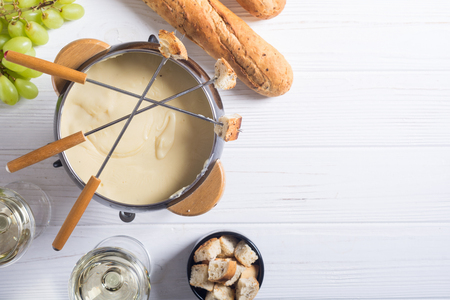 Cheese fondue with bread wine and grape . Swiss winter foodの写真素材