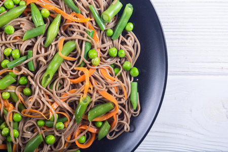 Soba noodles salad . Asian food background . Japanese bowlの写真素材