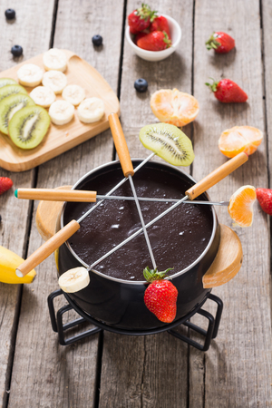 Dessert . Chocolate fondue whith fruit and berries . Food backgroundの写真素材