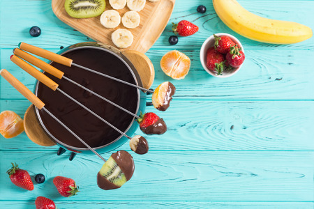 Dessert . Chocolate fondue whith fruit and berries . Food backgroundの写真素材