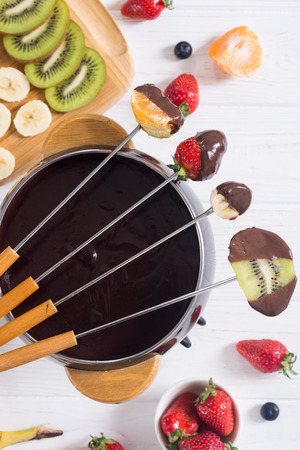Dessert . Chocolate fondue whith fruit and berries . Food backgroundの写真素材